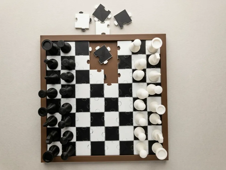 A printed chess board whose squares are jigsaw pieces, with chess pieces on it.