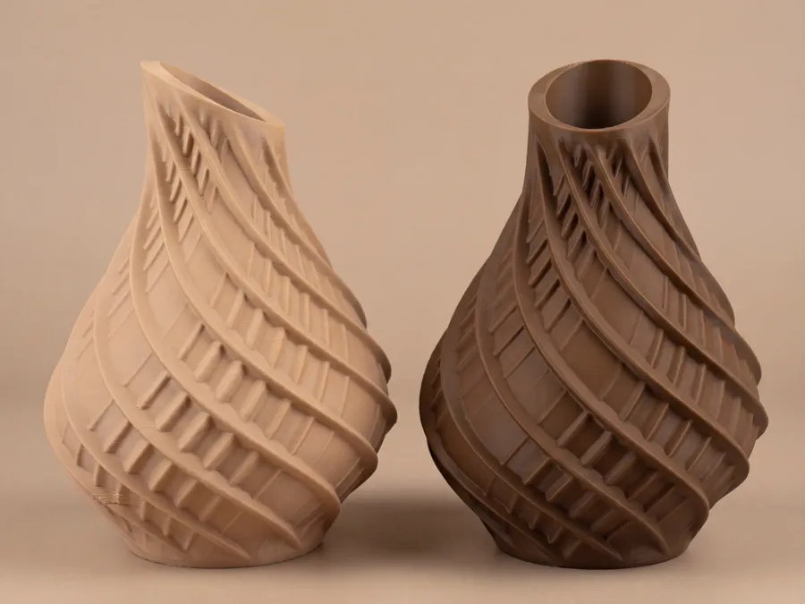 Two printed spiral vases with terraced ridges, in sand and brown.